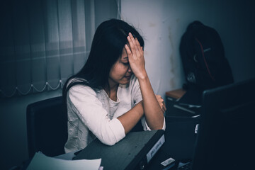 Fototapeta na wymiar Asian woman working in office,young business woman stressed from work overload with a lot file on the desk,Thailand people