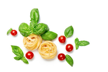 Cherry tomatoes, pasta and basil leaves on a white isolated background. Gamedients for dinner. Flat lay. Copy space.