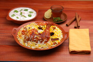 Chicken dum  Biryani_Indian Biriyani_wooden background