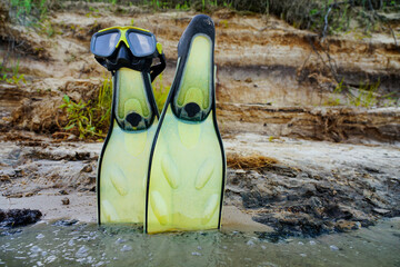 fins with a mask for diving in the water on the island