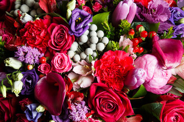 Floral arrangement with red and purple flowers