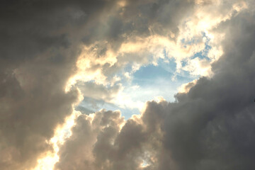 dark cumulus clouds white window among the dark sky