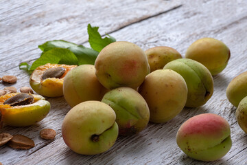 Apricot fruit. Fresh organic apricots on a white wooden background. Vega food.