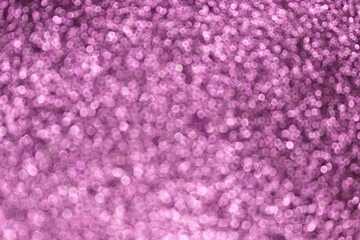 Violet glittering defocused background. Abstract blur celebration concept.