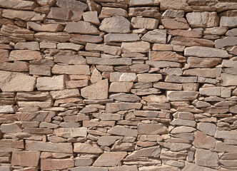 decorated stone wall in the garden of a villa in Sardinia
