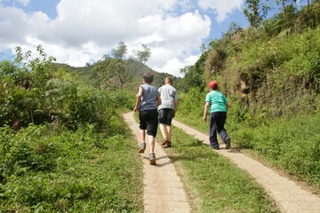 Boys walking along a mountain trail in Brazil