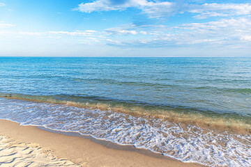 Seascape at sunset. Beautiful evening sky at sunset and sea surf.