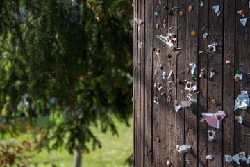 Empty wooden message stand outside. Message board with pins. Sunny day. Selective focus. Soft focus. Lack of news concept