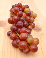 red grapes over wooden background