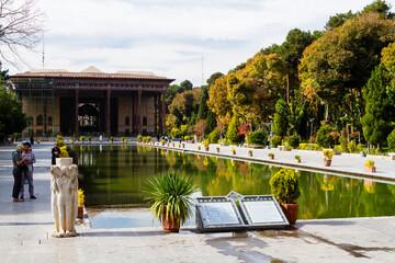 ISFAHAN, IRAN - NOV 18, 2016:  A long pool in front of the ancient Bagh-e Chehel Sotoun - Forty...