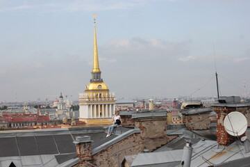 Fototapeta premium Saint-Petersburg, Russia - 10.06.20. Cityscape panorama of old central city part, view from a roof. Famous rooftops of St. Petersburg with Saint Isaac's Cathedralat the background.