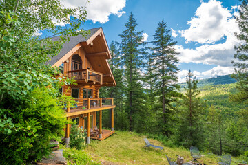 A 3 story log home with decks in the mountains near Coeur d'Alene, Idaho, USA