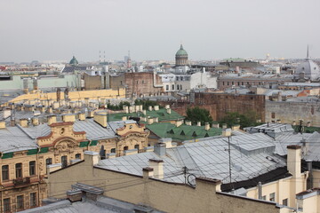 Saint-Petersburg, Russia - 10.06.20. Cityscape panorama of old central city part, view from a roof. Famous rooftops of St. Petersburg with Saint Isaac's Cathedralat the background.