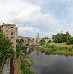 Fototapeta na wymiar Old bridge across Fluvia River in Besalu, Catalonia, Spain.