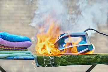 Iron for clothes caught fire on an ironing board.