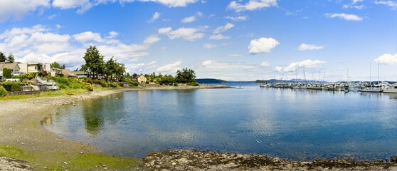 Tranquil walkway around marina with moored yachts in Sidney on Vancouver Island, British Columbia, Canada
