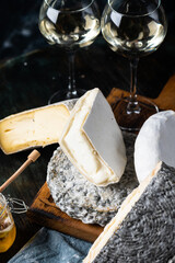 Various types of cheese composition. Gorgonzola, camembert, brie cheese. Roquefort, dor blue....