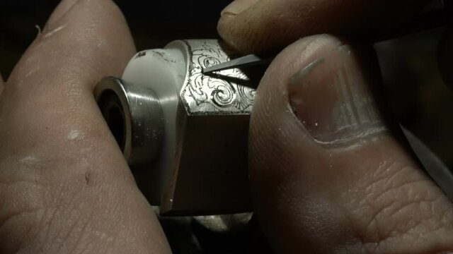 craftsman engraving on ring. Hand made special silver ring making. Close up craftsman workshop close up shooting.