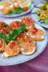 Buffet table with snacks, canape and appetizers at luxury wedding reception outdoors, copy space. Serving food at event. Catering banquet table