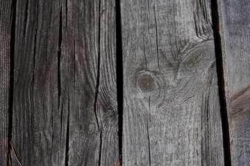 Natural background of old boards and old nails inside

V