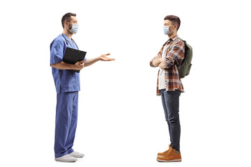Fototapeta premium Medical worker with a face mask talking to a guy with mask