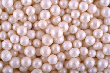 White chocolate candies abstract background, copy space. Sweets abstract texture. Top view, flat lay