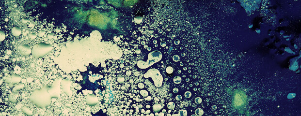 Blue color Abstract bubble drop texture background. Acrylic color in water and oil. Horizontal long banner.