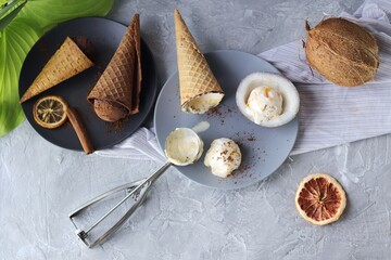 Homemade ice cream in waffle cones, coconuts on the kitchen table by the window, preparing a healthy dessert