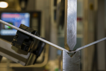 operator bending metal sheet by sheet bending machine