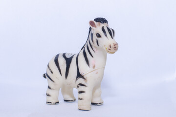 Child zebra toy on isolated white background
