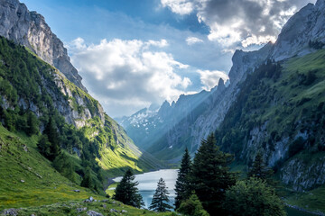 Fototapeta na wymiar An alpine mountain lake in Appenzell Switzerland on an early morning just after sunrise