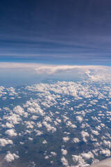 Fototapeta na wymiar Clouds in airplane window