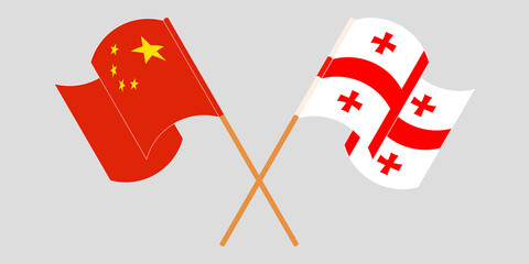 Crossed and waving flags of Georgia and China