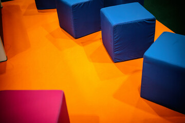 furniture in the form of cubes with textile upholstery in bright colors, geometric shapes, public...