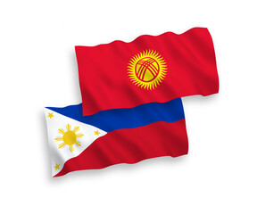 National vector fabric wave flags of Kyrgyzstan and Philippines isolated on white background. 1 to 2 proportion.