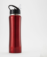 Full length red aluminium waterbottle. Isolated on white background.