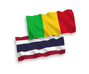 National vector fabric wave flags of Mali and Thailand isolated on white background. 1 to 2 proportion.