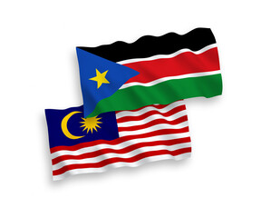 National vector fabric wave flags of Republic of South Sudan and Malaysia isolated on white background. 1 to 2 proportion.