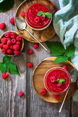Raspberry Panna cotta with raspberry jelly, Italian dessert, homemade cuisine. Top view flat lay...