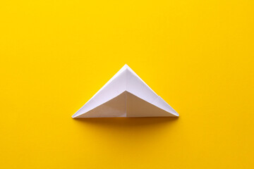 assembly procedure for a white paper ship. Origami.