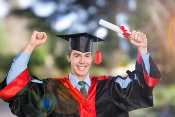 Happy and excited young student man in the hat of graduation