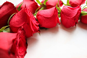 postcard mockup. bouquet of red roses on a white background. congratulation. invitation