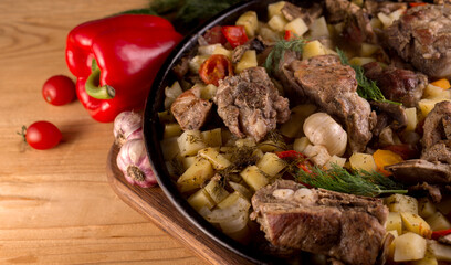 Grilled pork ribs on vegetables. Main course with a side dish.