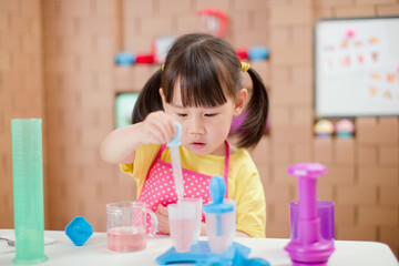 toddler girl making ice lolly for homeschooling