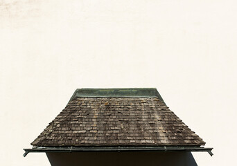 Canopy with old wooden shingles. 
Wooden roof over the door. Vordach mit alten Dachschindeln aus...