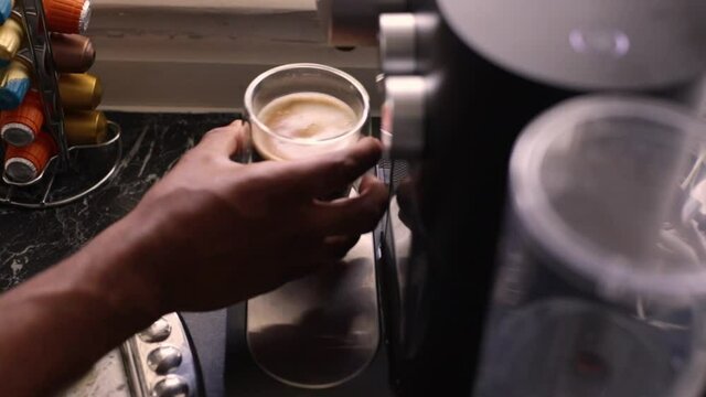 Top view person preparing bulletproof coffee with nespresso machine