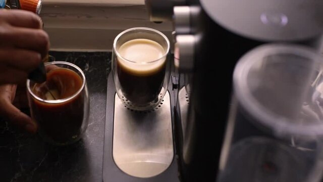 Top view person preparing bulletproof coffee with nespresso machine