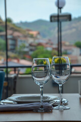 Wine and water glasses. Restaurant with a view of old Tbilisi, Georgia. July 07, 2020