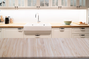 Wood table top on blur kitchen room