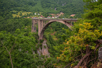 Fototapeta na wymiar Mountain landscape, Montenegro. Durdevica Tara arc bridge in the mountains, One of the highest automobile bridges in Europe.